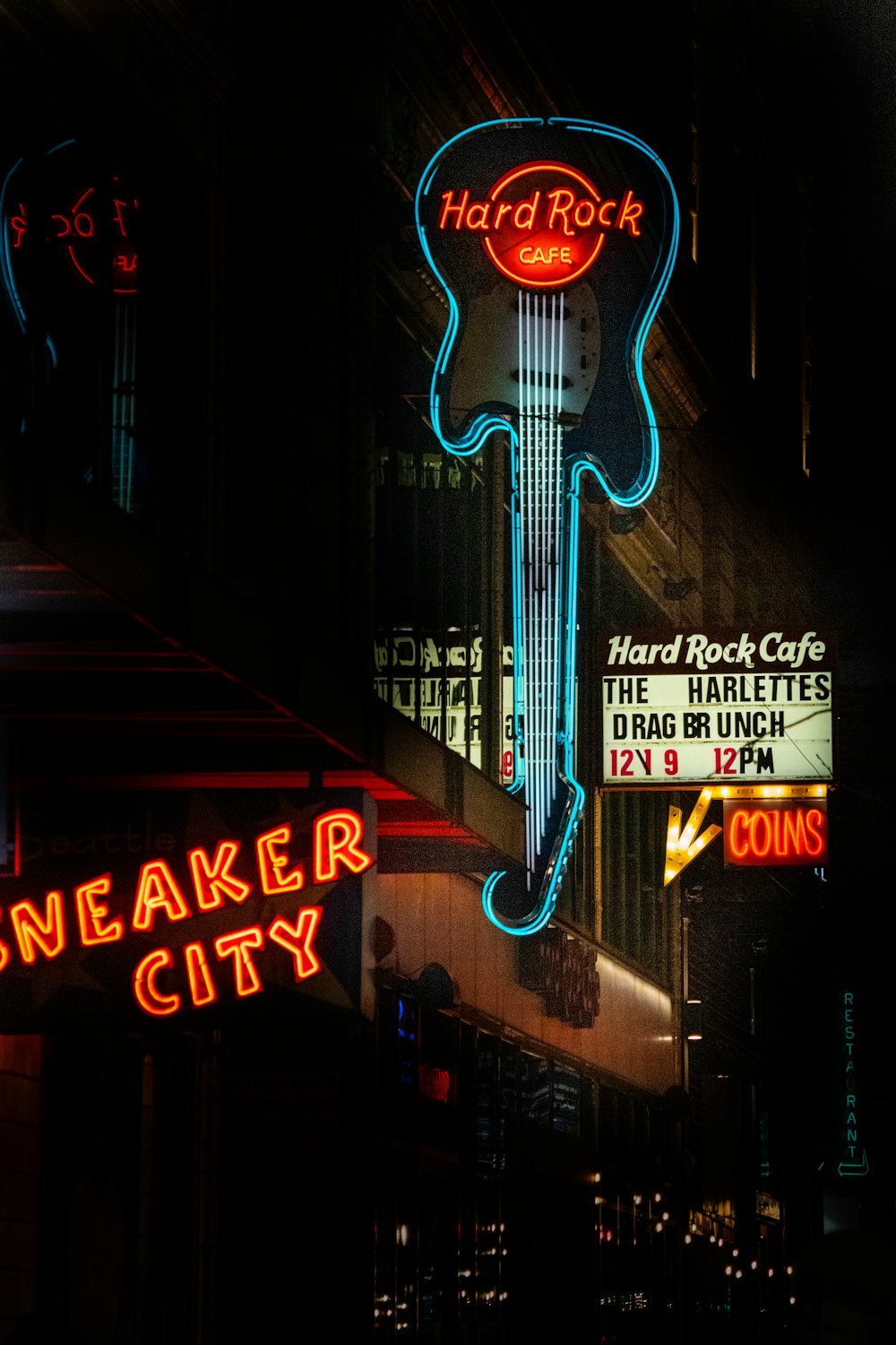 a neon sign for a rock and roll restaurant