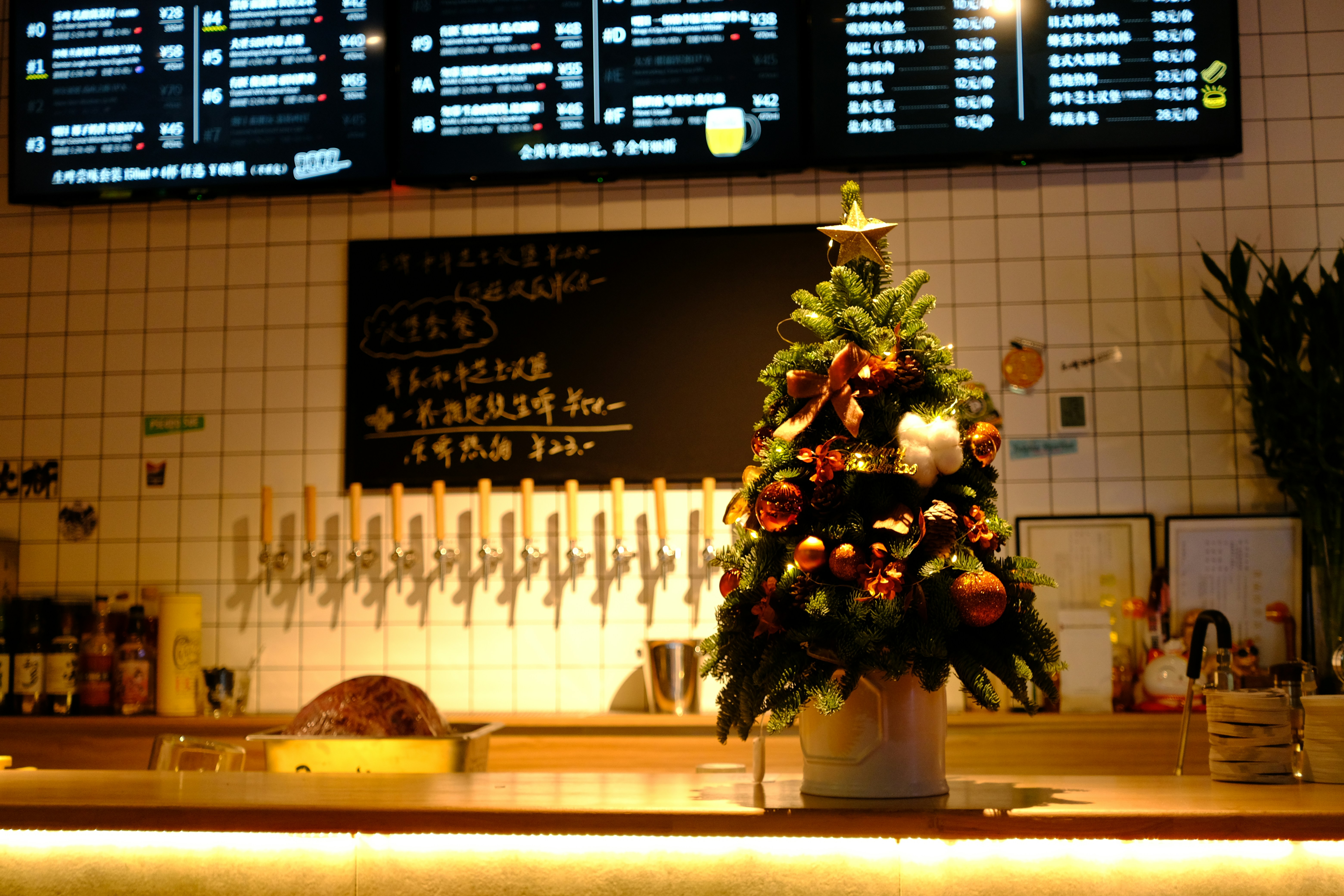 a small christmas tree sitting on top of a counter