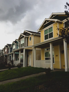 a row of houses on a cloudy day