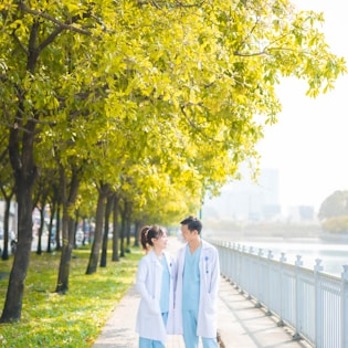 a couple of people that are walking down a sidewalk