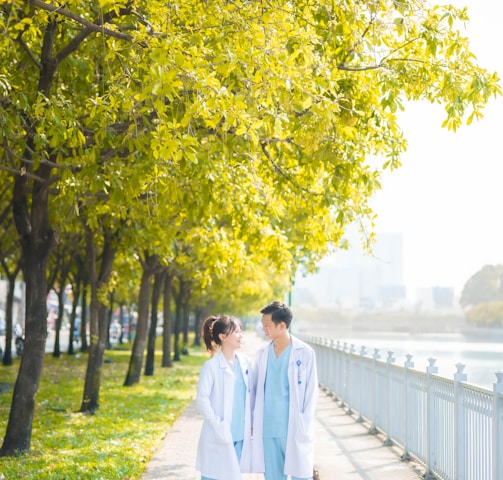 a couple of people that are walking down a sidewalk