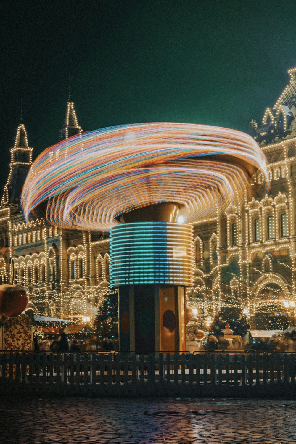 a merry go round in front of a large building