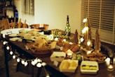 a wooden table topped with lots of food