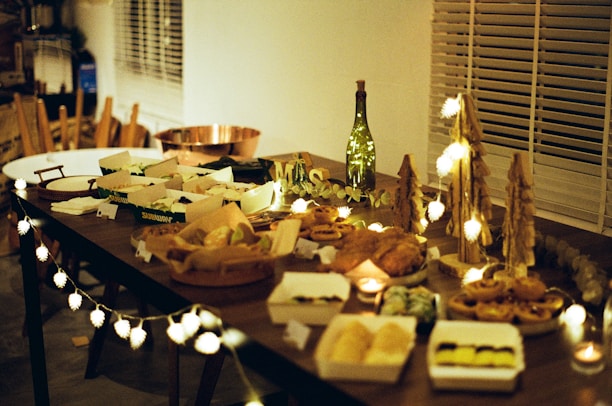 a wooden table topped with lots of food