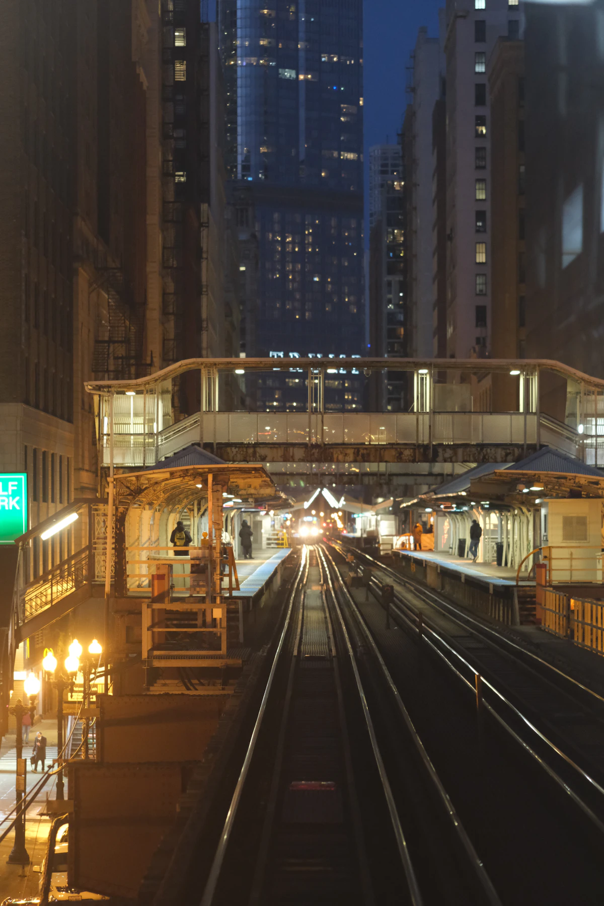 Red train at an elevated Chicago station at dusk