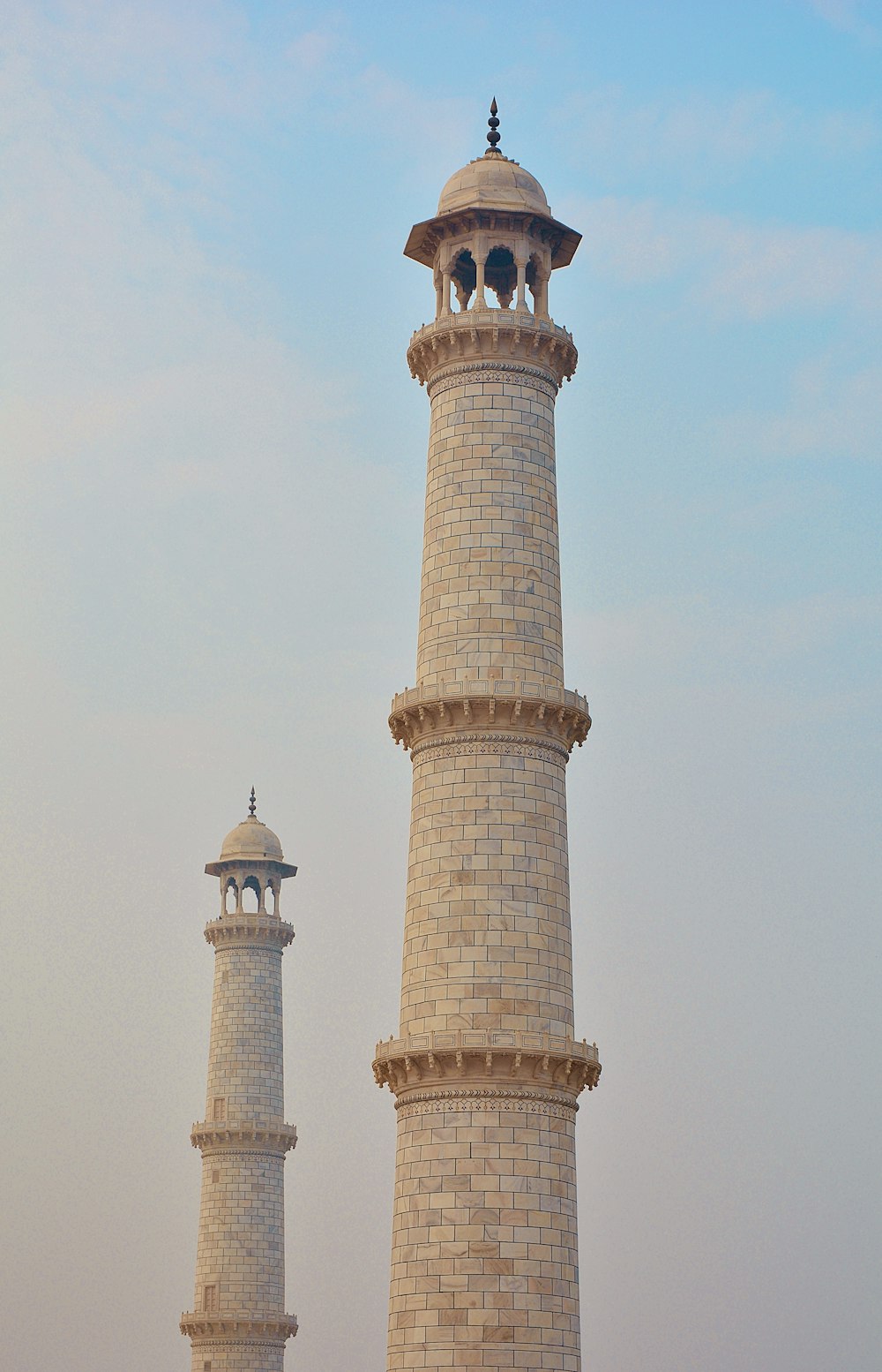 a couple of tall towers sitting next to each other