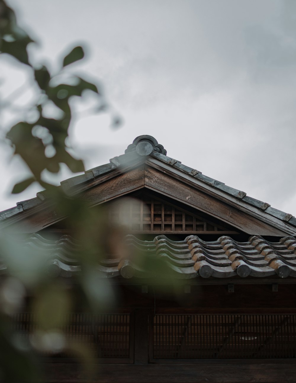 the roof of a building with a bird perched on top of it