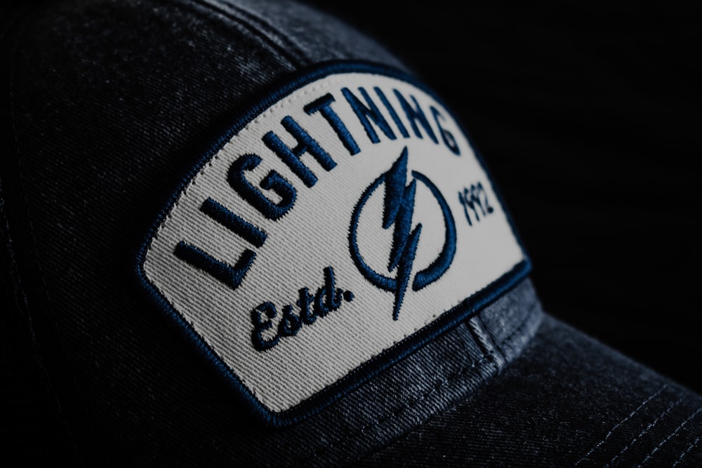 a hat with a lightning patch on it