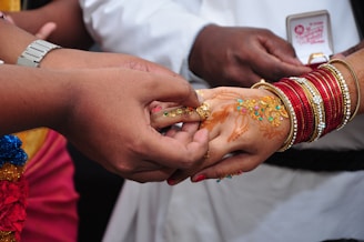 a close up of a person holding another person's hand
