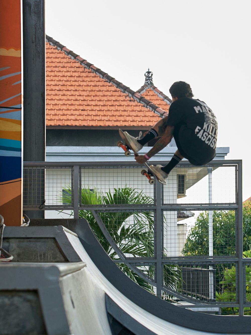 a man riding a skateboard up the side of a ramp