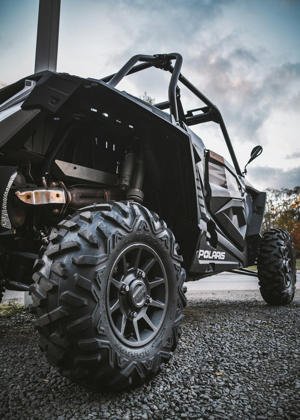 a close up of a vehicle on a gravel road