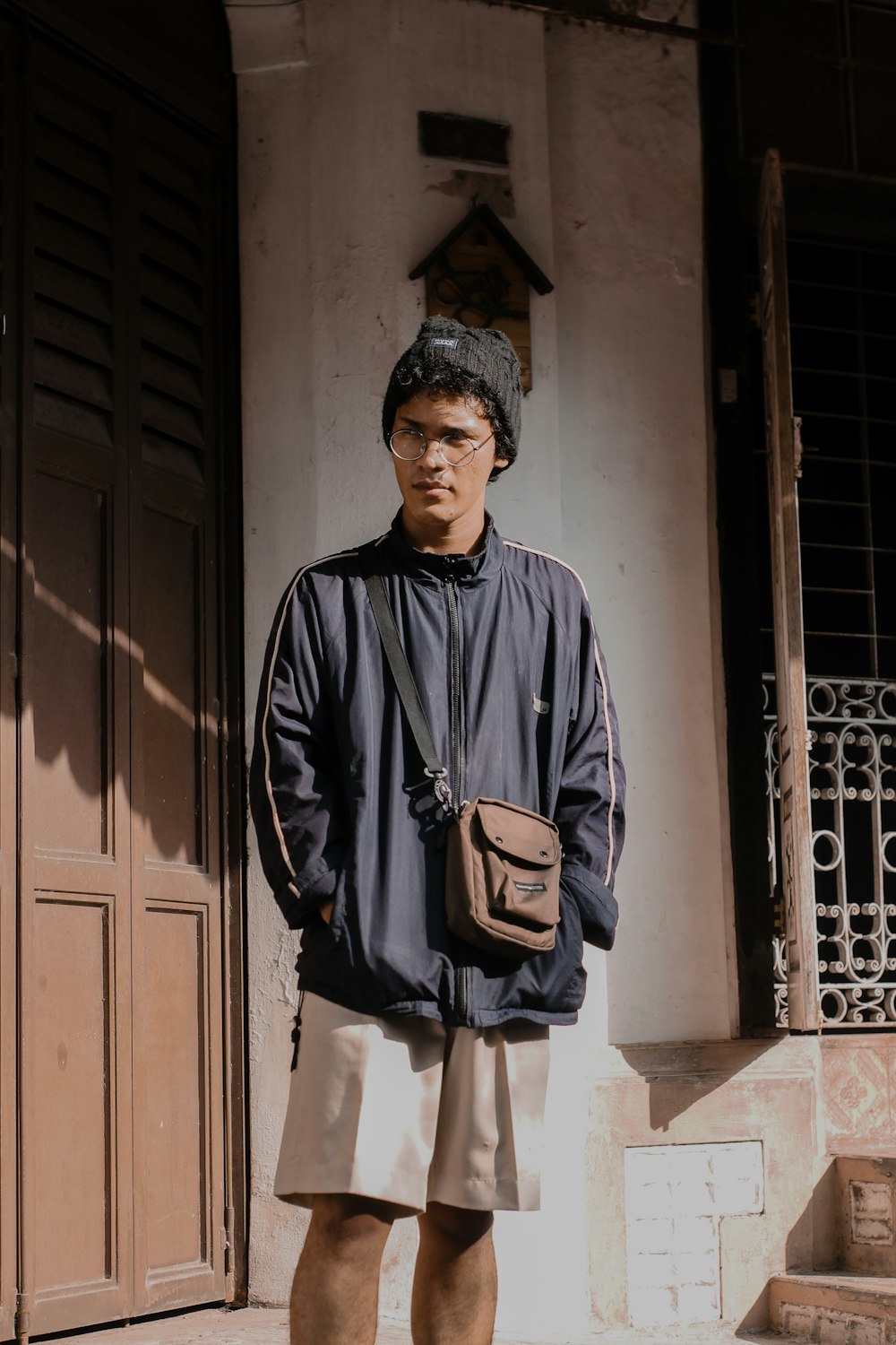 a man standing in front of a building