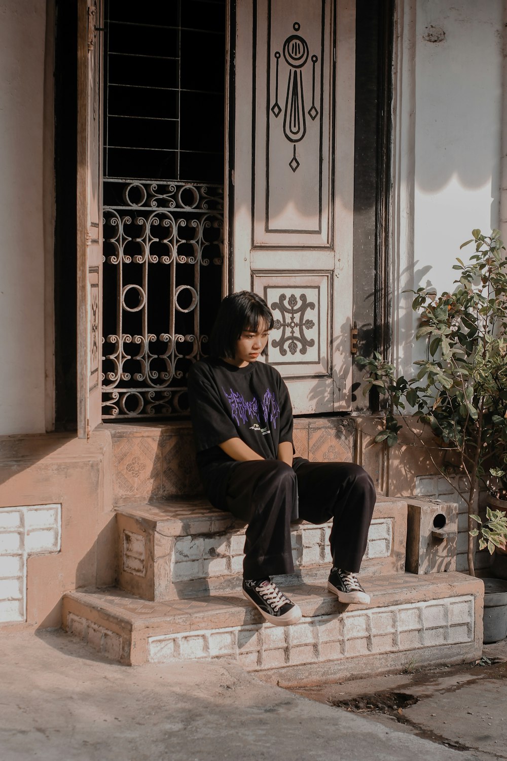 a man sitting in front of a window