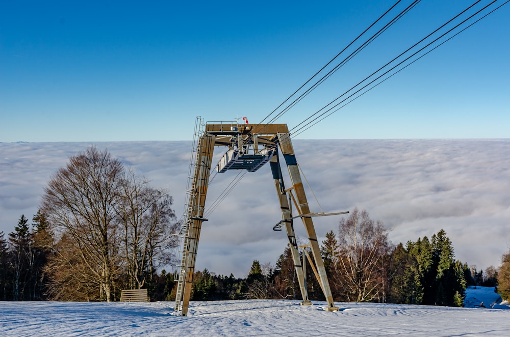 a ski lift going up a snowy mountain