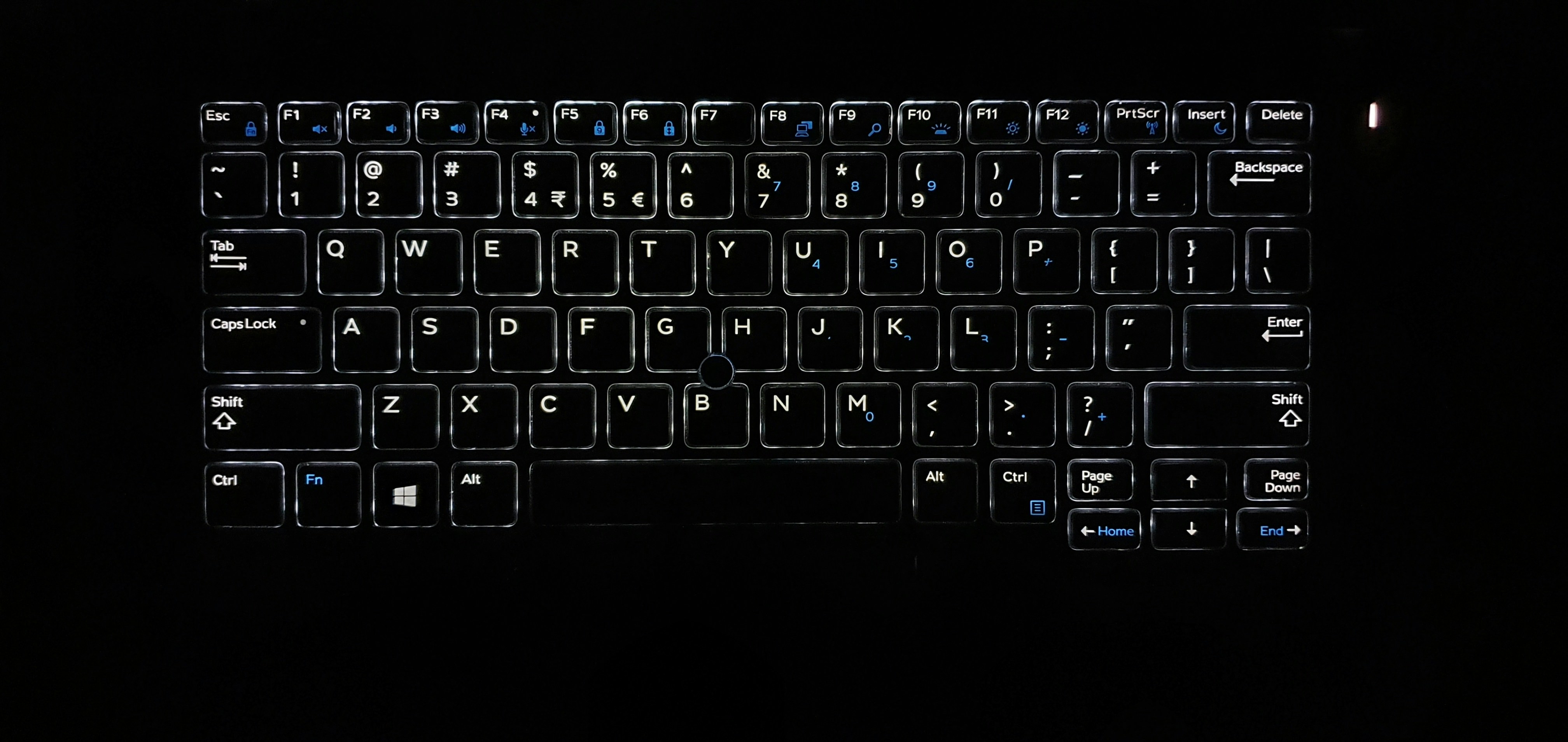 Laptop keyboard closeup, bright well-lit studio photography