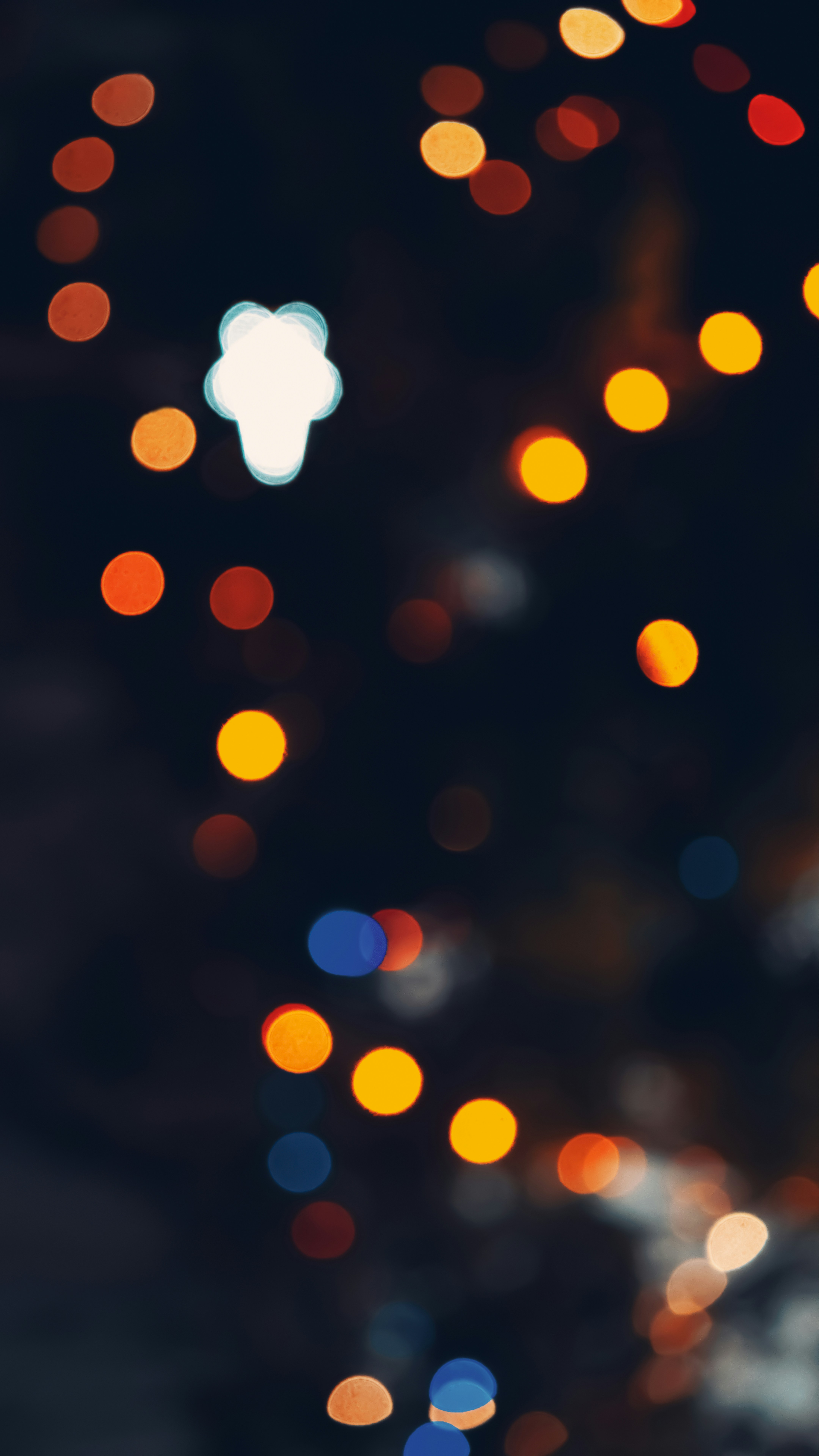 a blurry photo of a city street at night