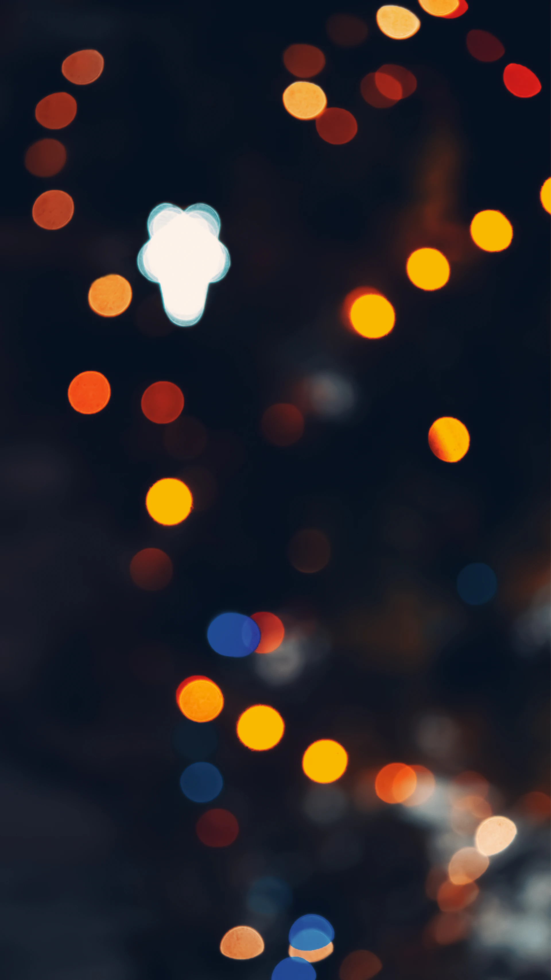 a blurry photo of a city street at night