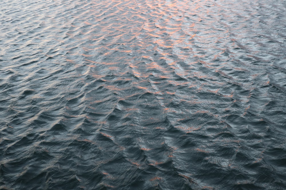 a large body of water with ripples in it