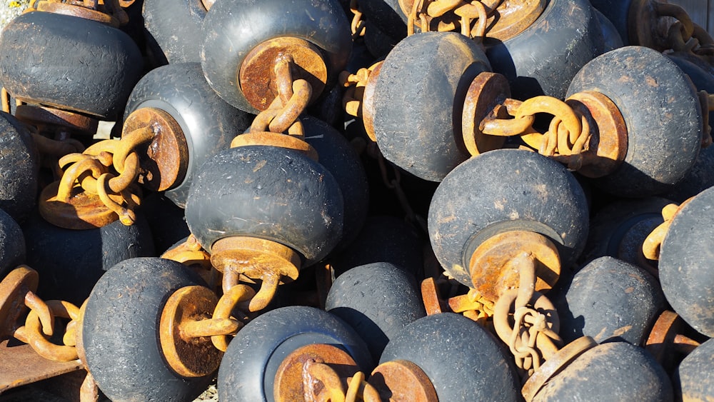 a pile of old tires with chains on them