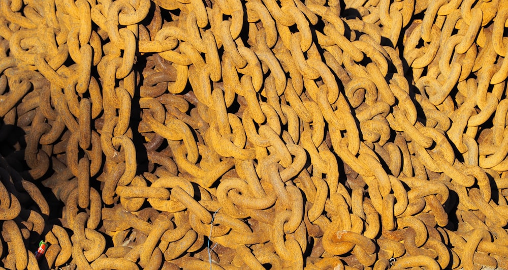 a bunch of yellow chains sitting on top of each other