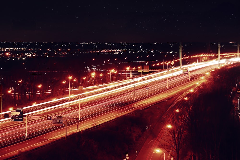 a night time view of a highway with lights