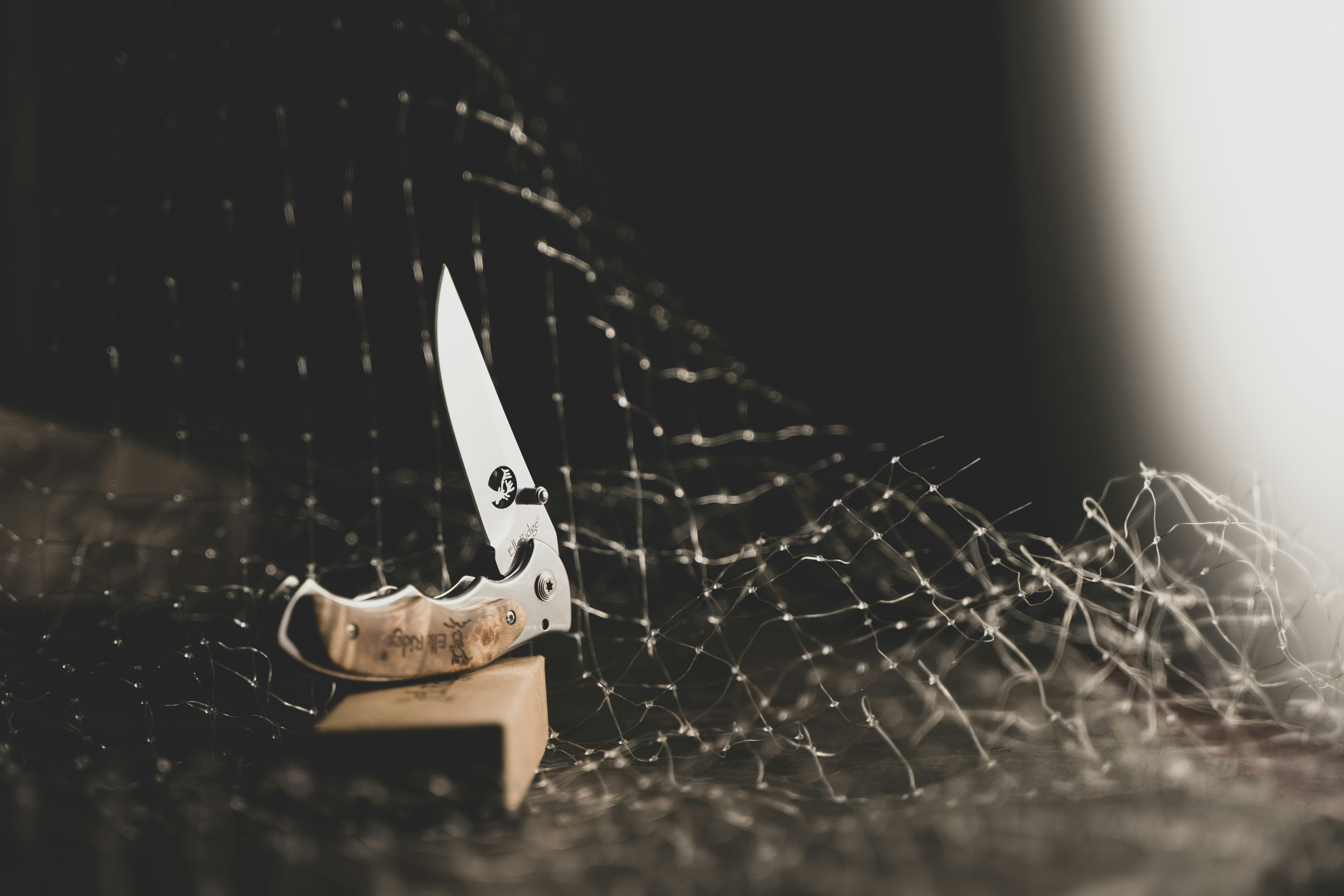 a knife sitting on top of a wooden block