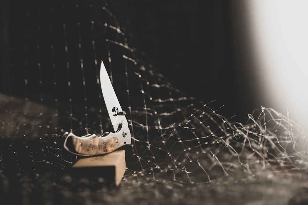 a knife sitting on top of a wooden block