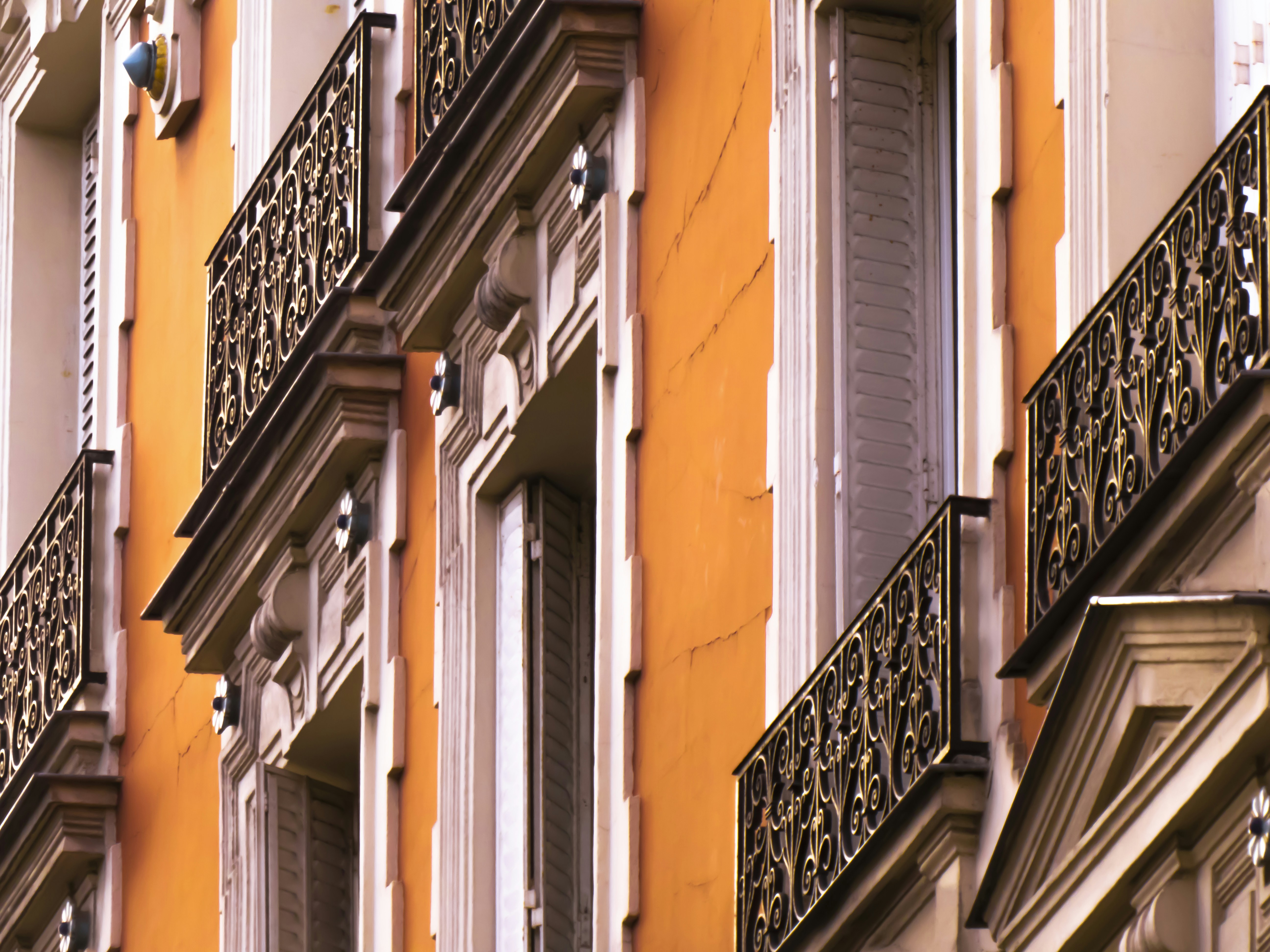 a close up of a building with many windows and balconies, 