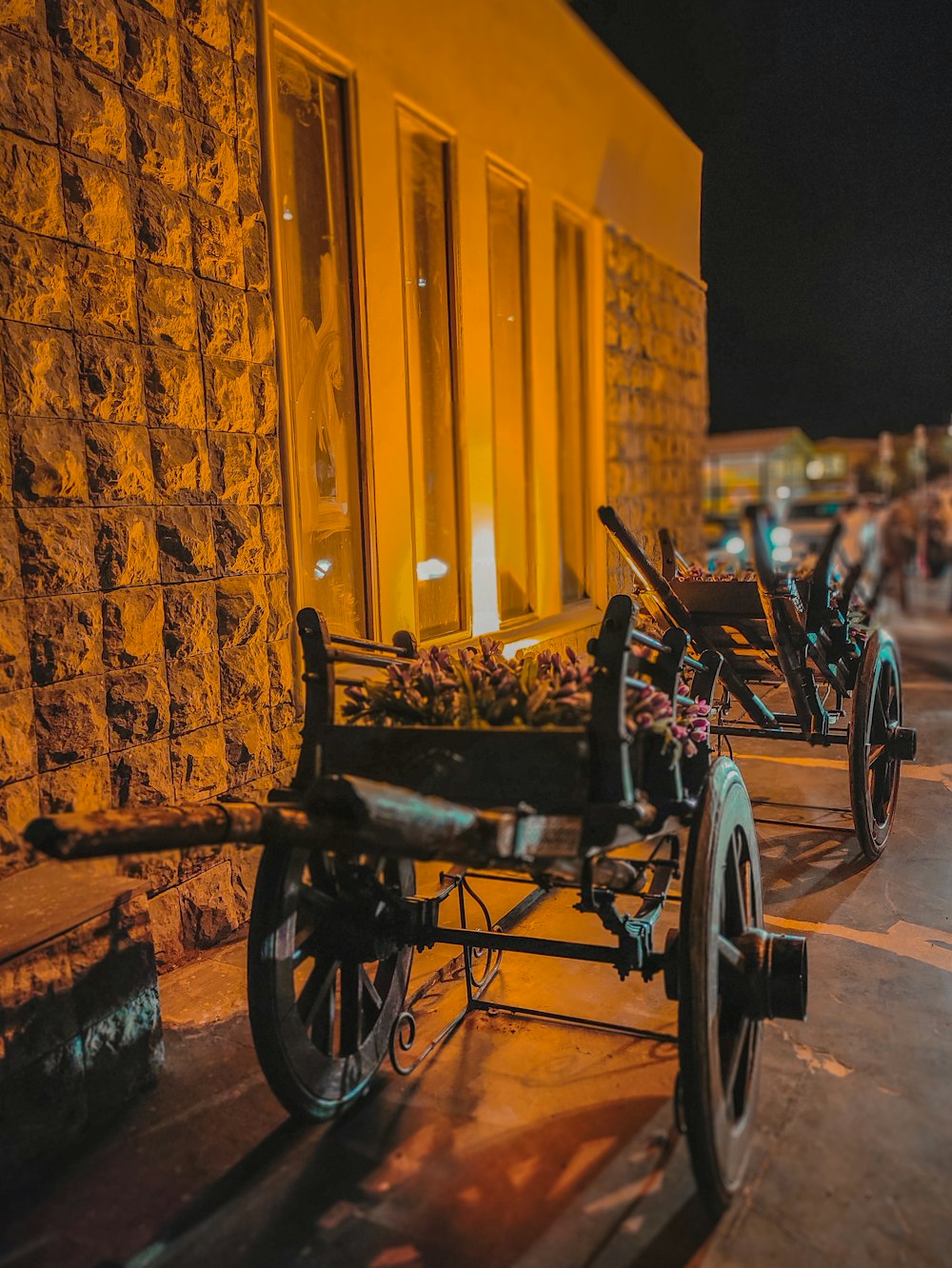 an old fashioned wagon is parked on the side of the street