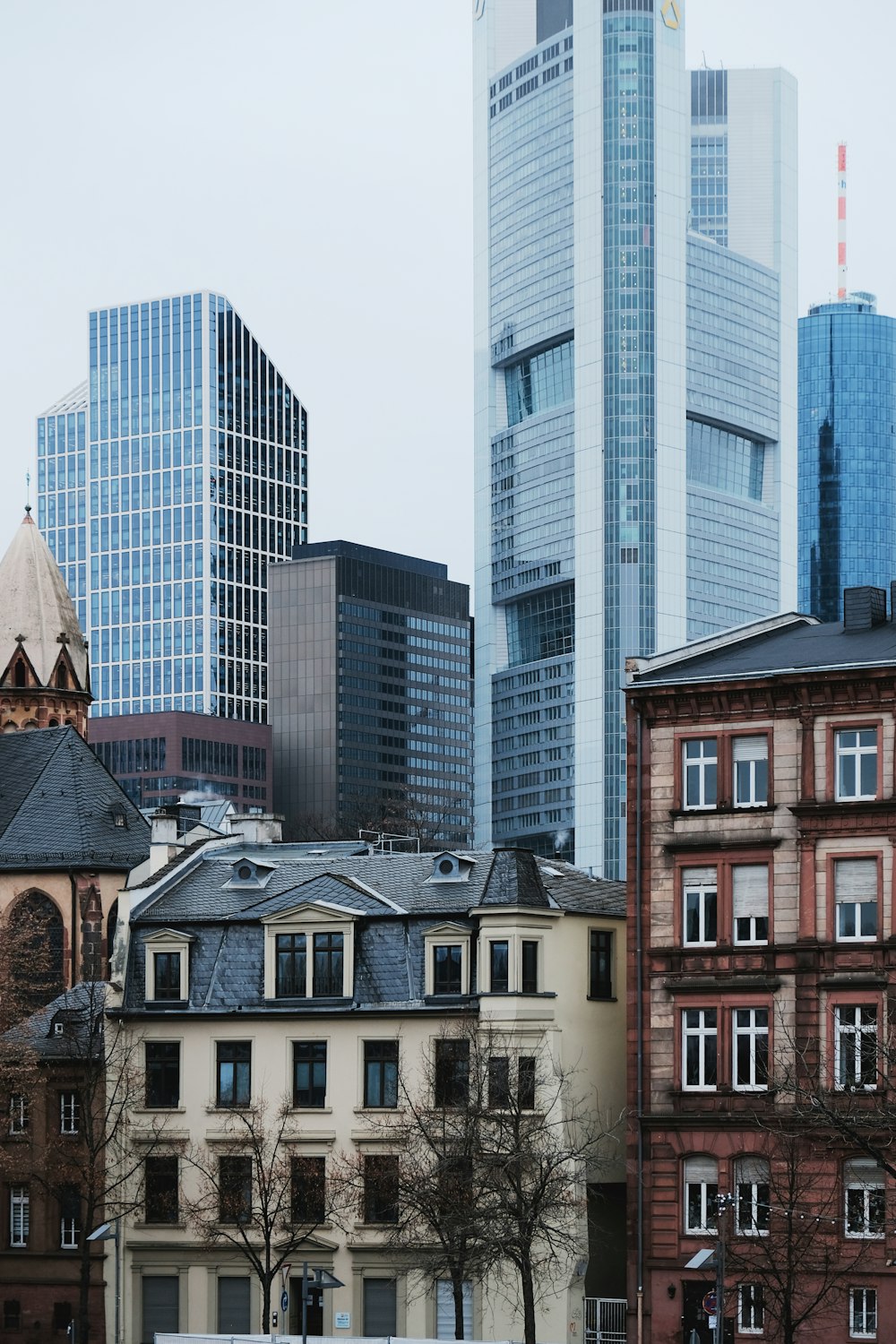 a group of buildings in a city with tall buildings