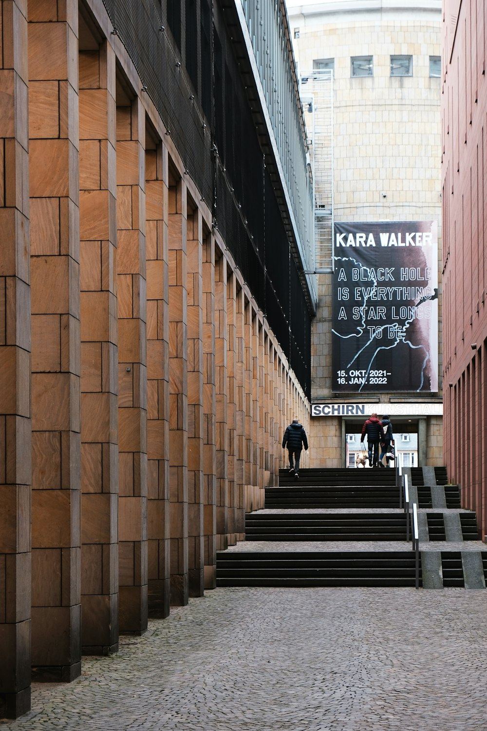 a couple of people that are walking up some stairs