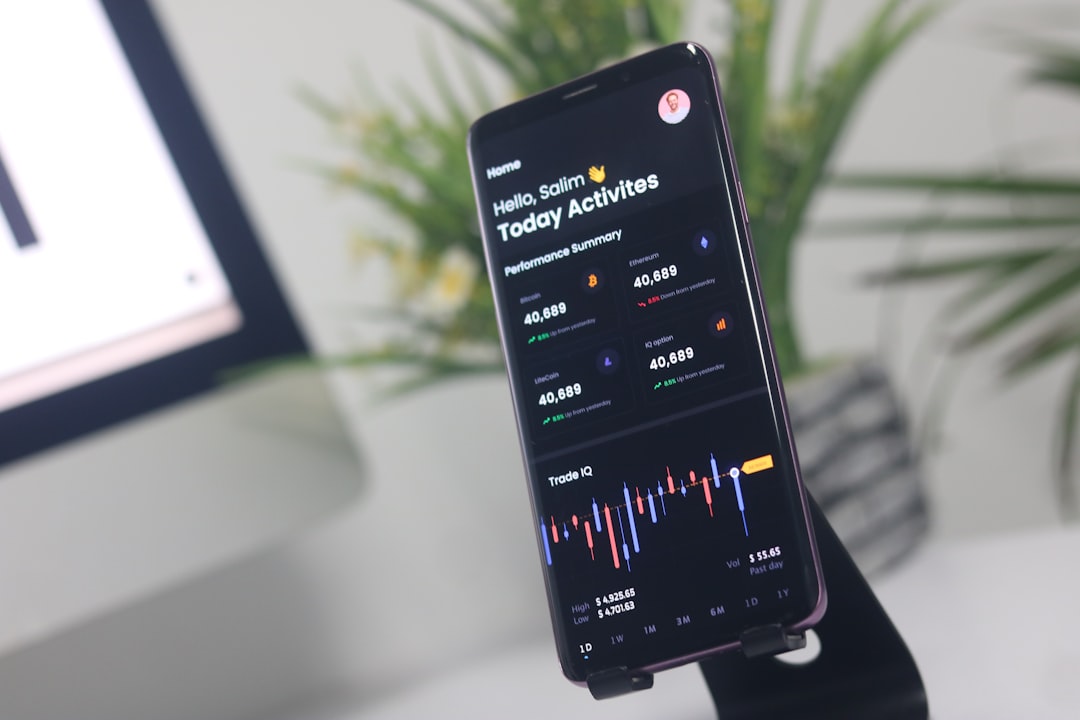 a cell phone displaying a chart on a stand, Blockchain Mobile App UI/UX Design