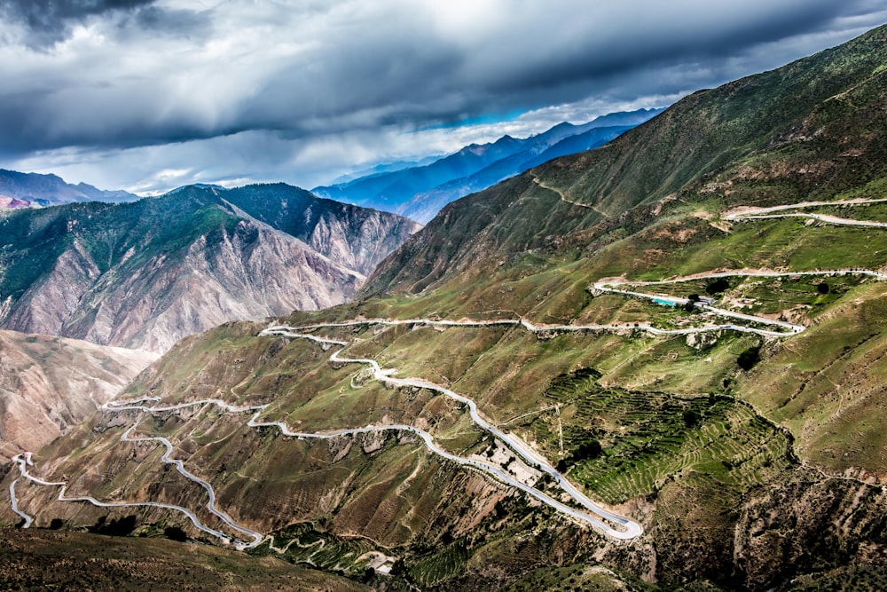 a view of a winding road in the mountains