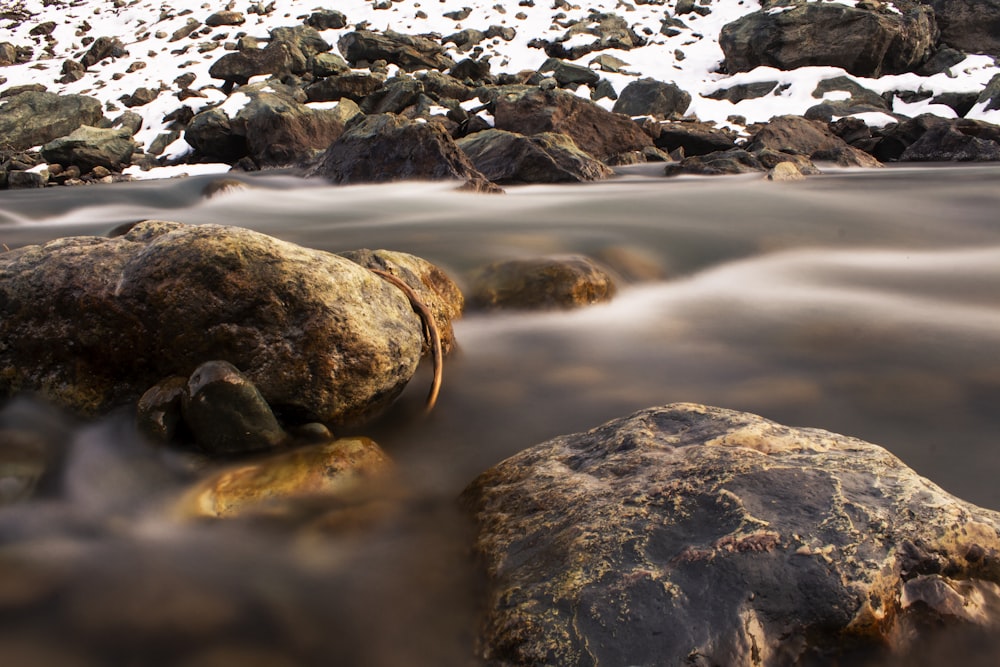 a stream of water running between two large rocks