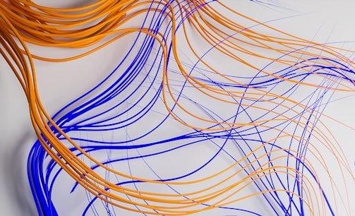 a bunch of orange and blue wires on a white surface