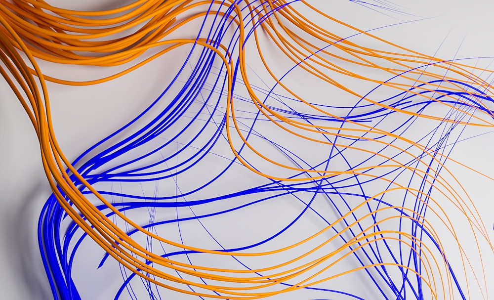 a bunch of orange and blue wires on a white surface