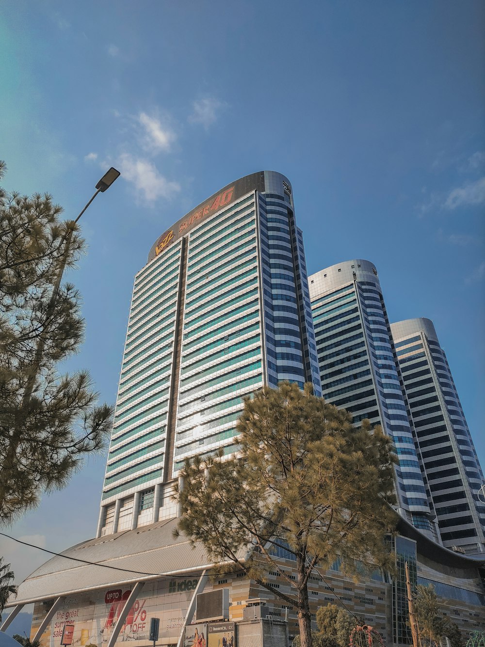 a very tall building sitting next to a street light