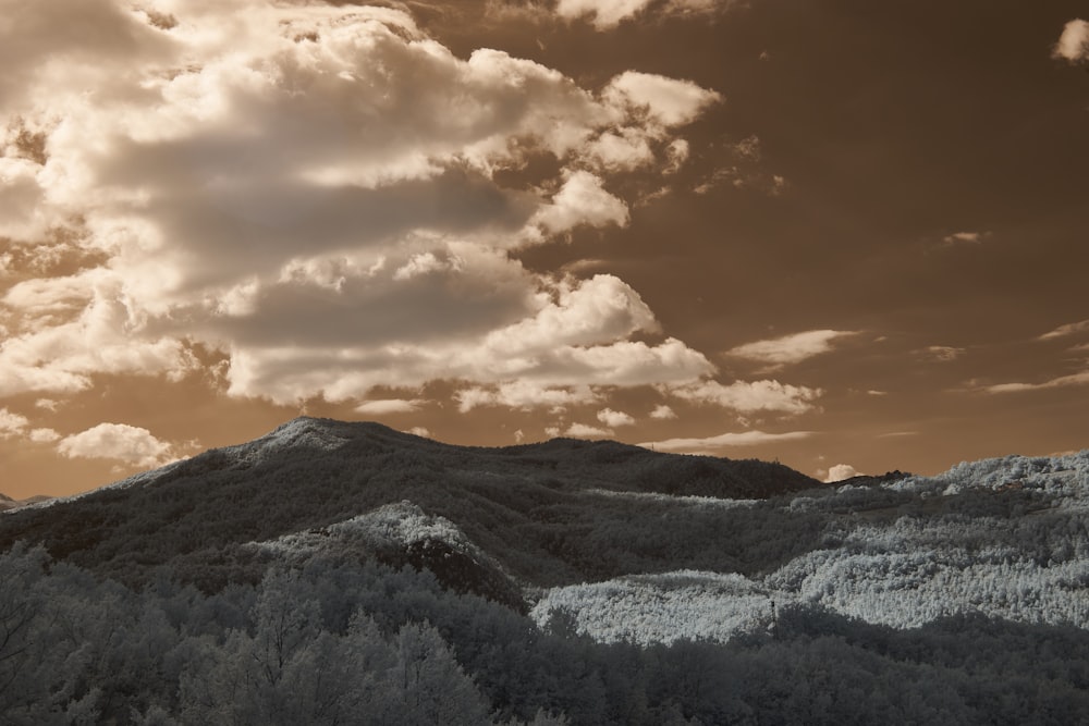 a black and white photo of a mountain range