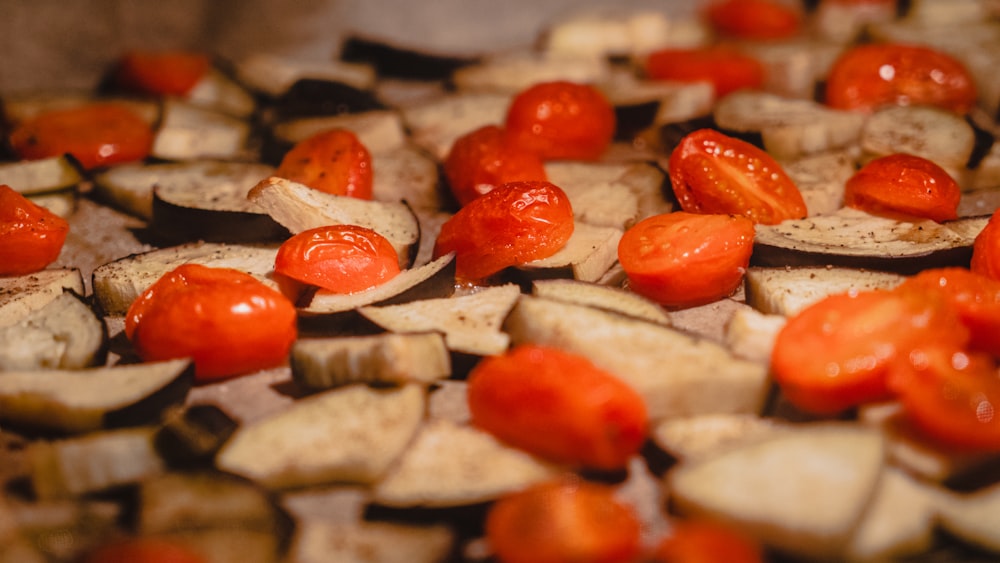 a pile of sliced up tomatoes and potatoes