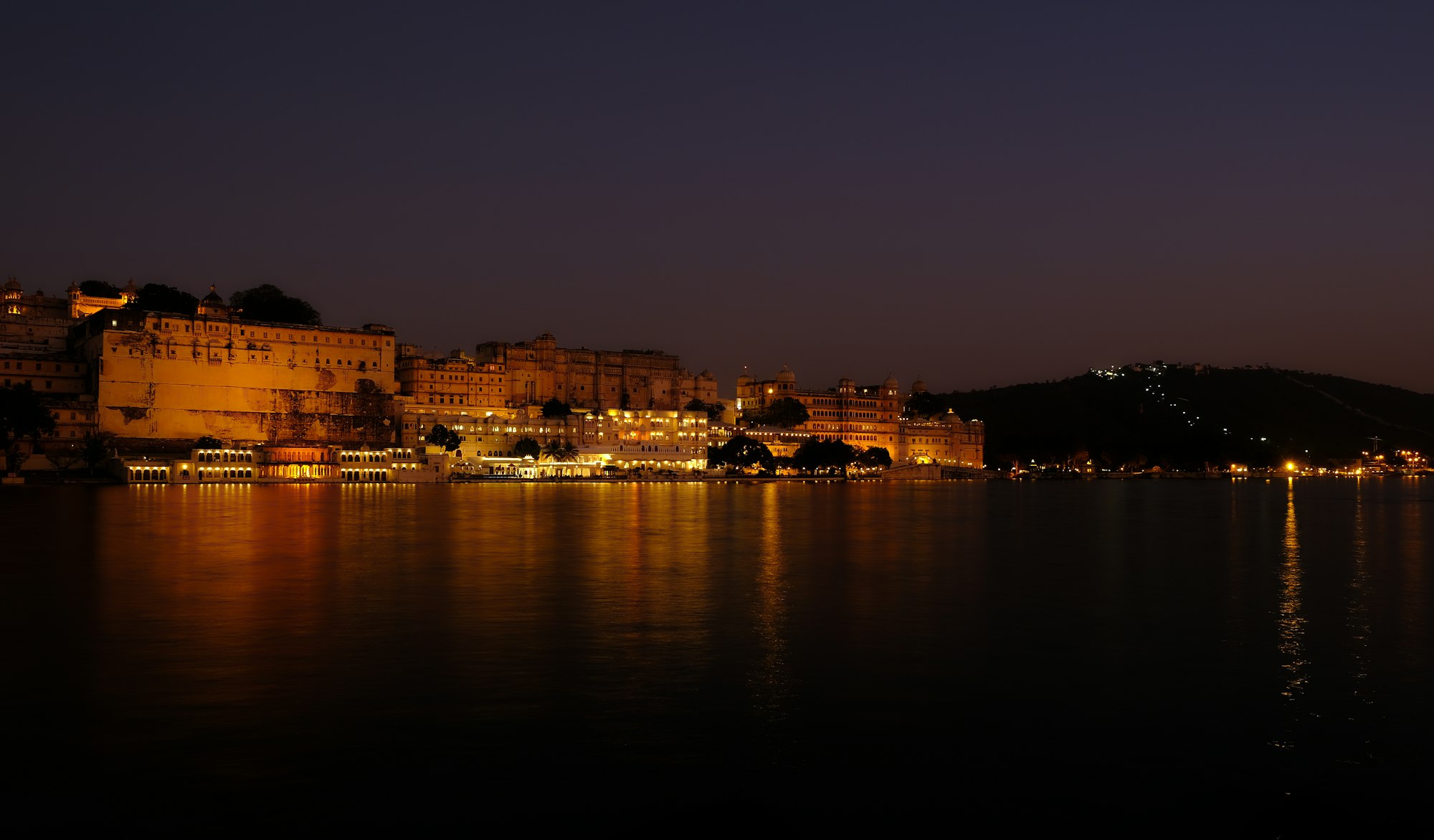 View of city palace from Ambrai Ghat at sunset.