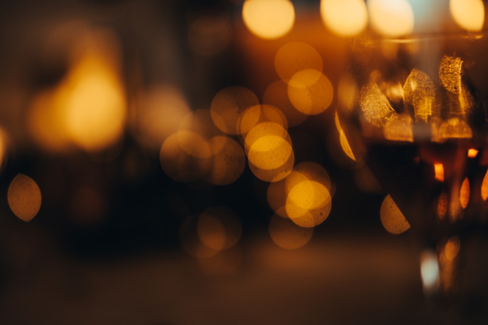 a glass of wine sitting on top of a table