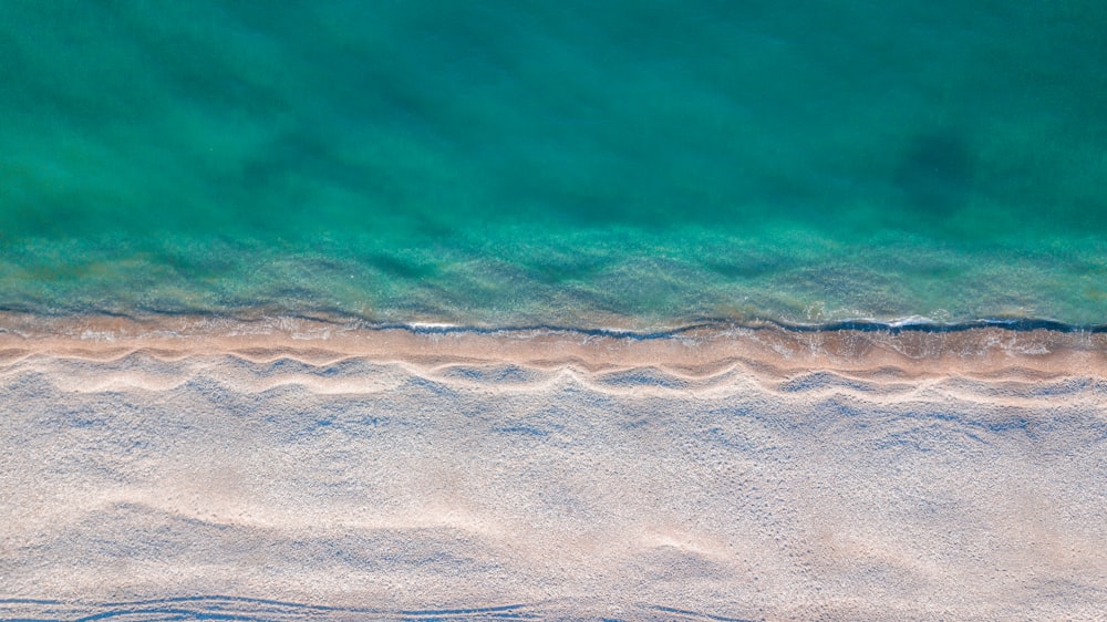 a bird's eye view of a beach and ocean