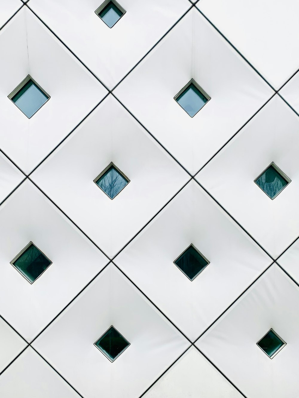 a close up of a building with many square windows