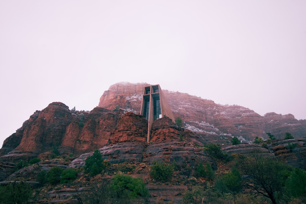 a very tall mountain with a window in it