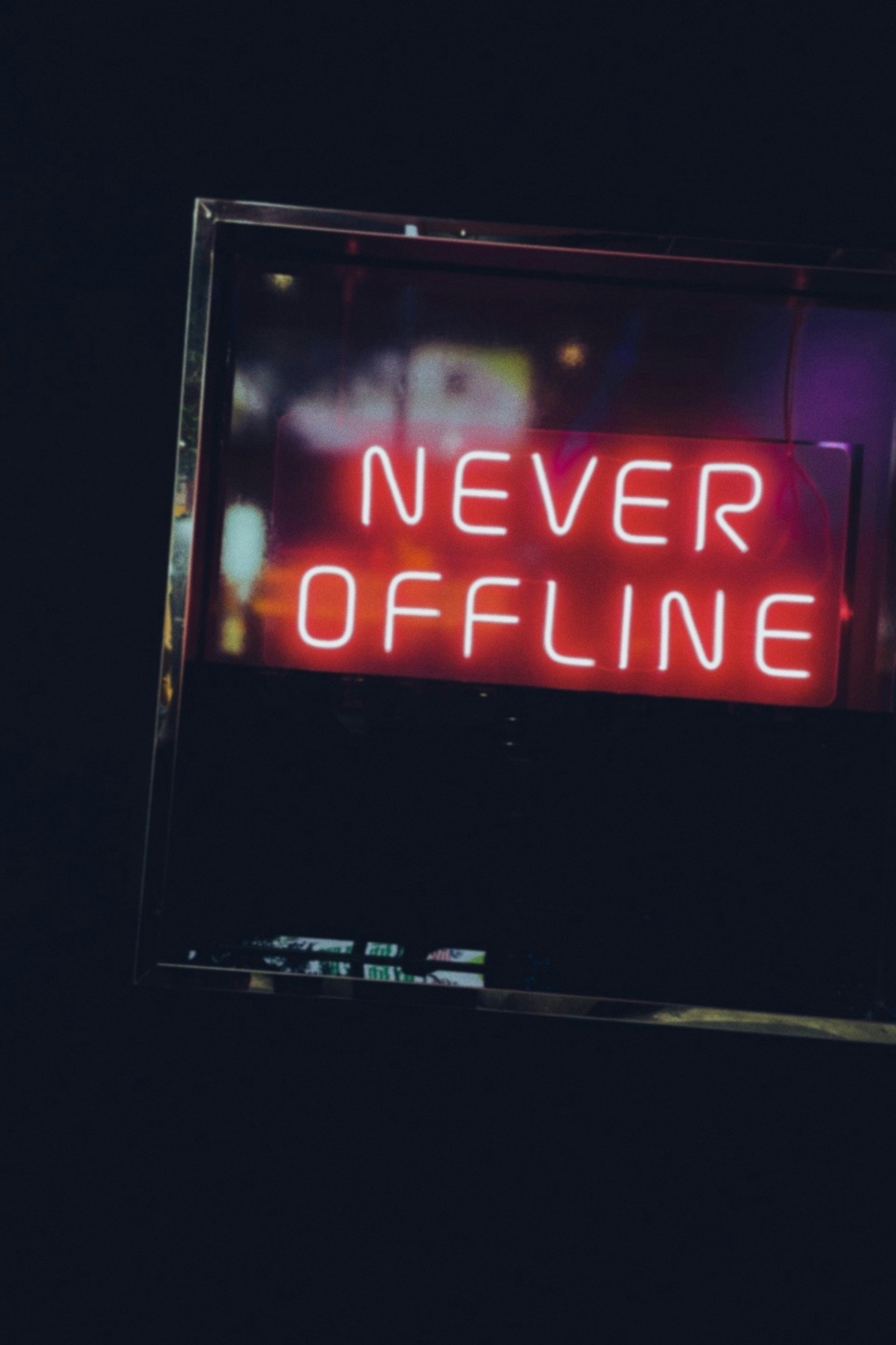 a neon sign that says never offline