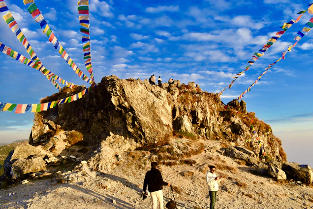 A colorful collage of travelers enjoying diverse pilgrimage sites and scenic landscapes under a magenta sky.