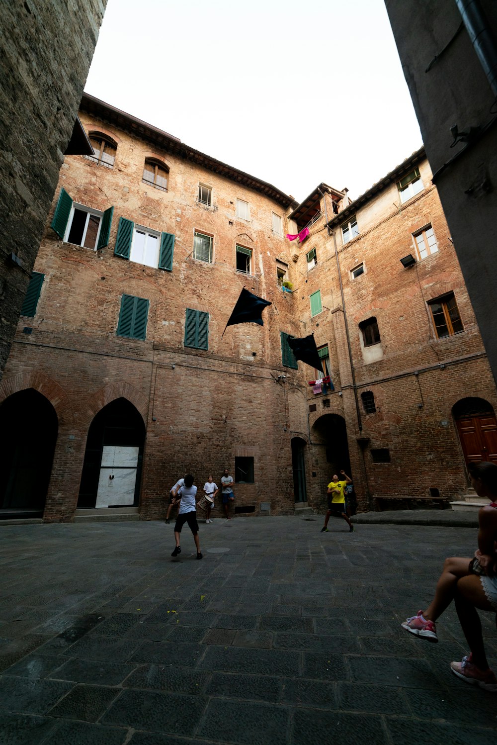 a group of people playing a game of basketball