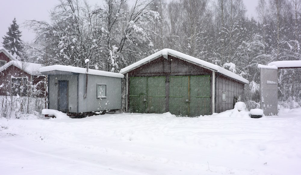 a couple of garages sitting next to each other in the snow