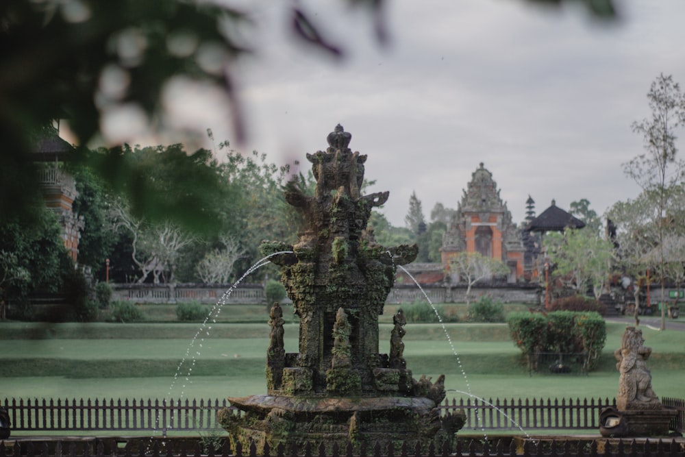 a fountain in the middle of a park