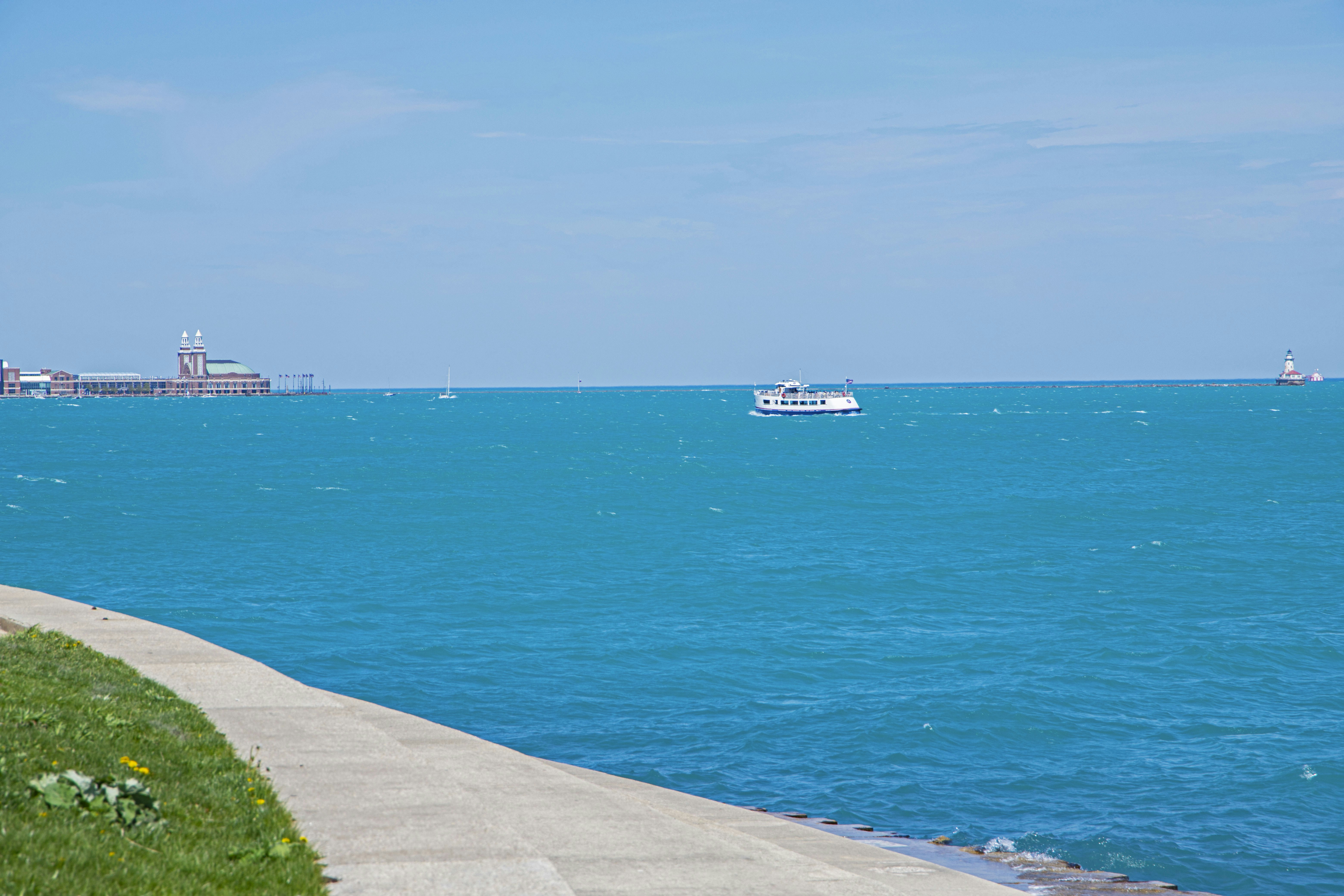 a boat is out in the ocean on a sunny day